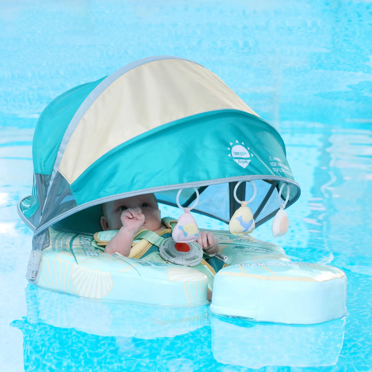 Removable UPF 50+ sun canopy on the Mambobaby Seashell Travel air-free baby float.