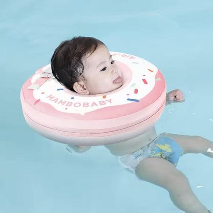 Baby in a pool using the Mambobaby Spa air-free float, with an adult within arm's reach.